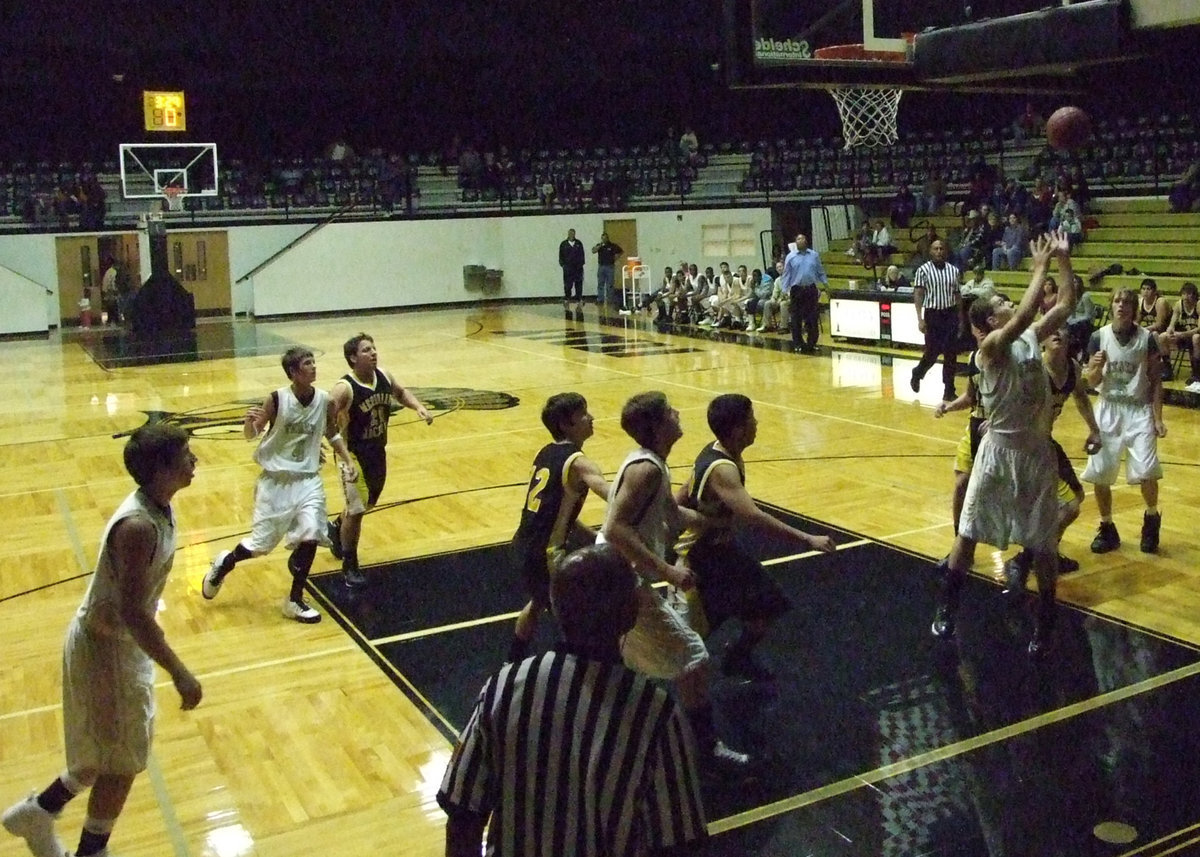 Image: Kyle Wilkins — Wilkins #50 rebounds the ball.