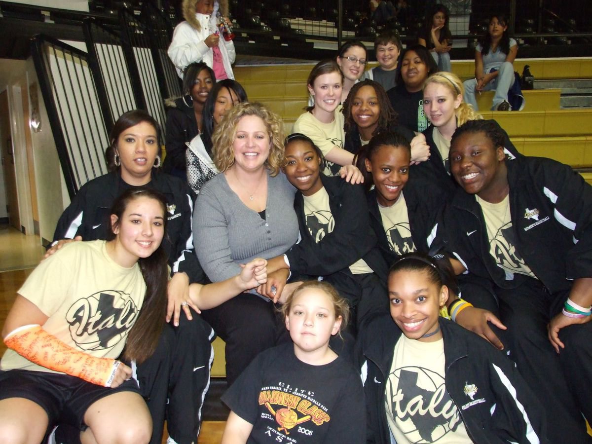 Image: Happy Birthday to Coach Stacy McDonald! And many more… — Coach Stacy McDonald celebrates her birthday with Assistant Coach Tina Richards and the Lady Gladiators basketball team. Coach McDonald received a team victory and cake on her special day.