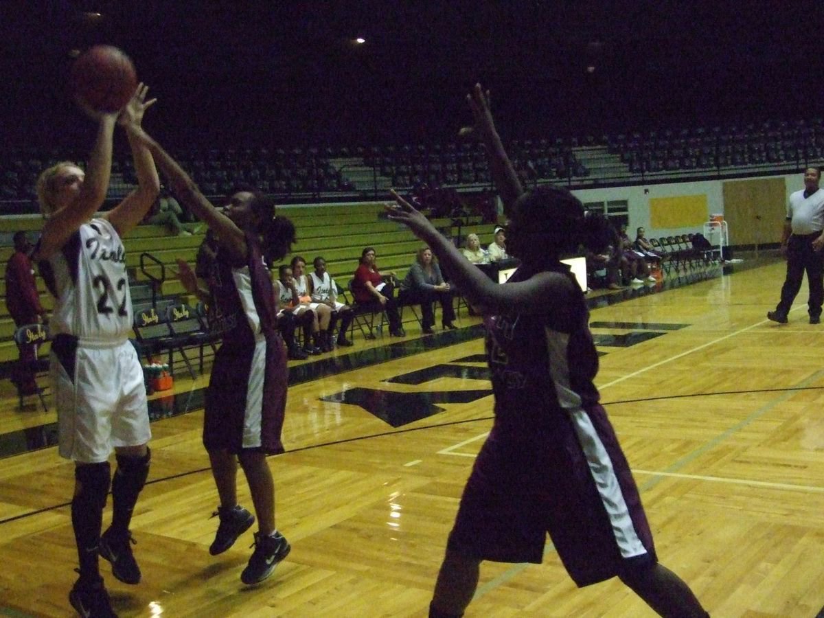 Image: Take that — Lady Gladiator Megan Richards(22) takes a baseline jumper over the lady Eagles