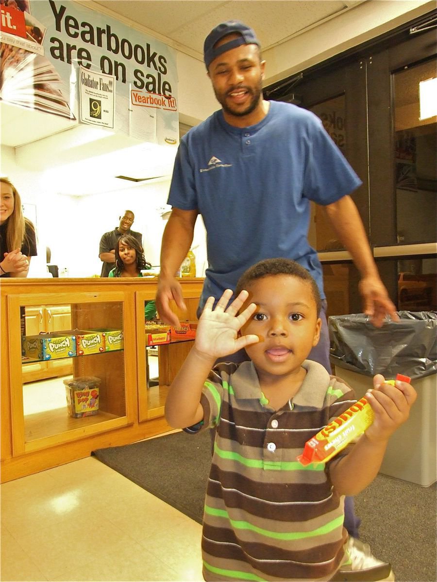 Image: Felling “Lucky” — “Lucky” is all excited after his dad, Corey Johnson, buys him a candy bar from the concession stand.