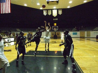 Image: Colton fires away — Colton Campbell(5) pulls up for a jumper at the top of lane.