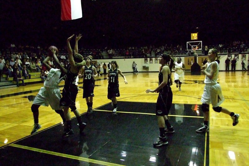 Image: Jameka drives in — Lady Gladiator Jameka Copeland(5) banks in a shot over a Grandview defender.