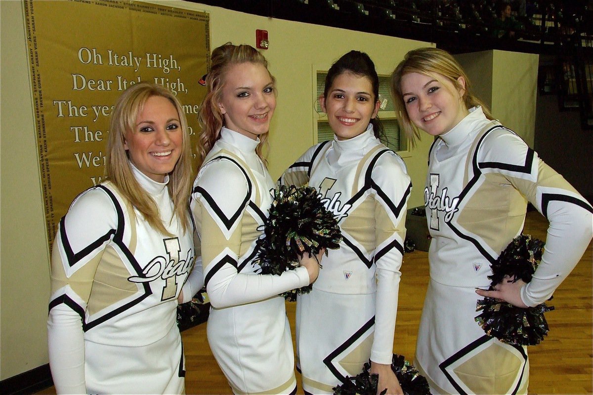 Image: The Fab Four — IHS cheerleaders Mary Tate, Sierra Harris, Beverly Barnhart and Taylor Turner keep the spirit up during Pack The Dome Night.