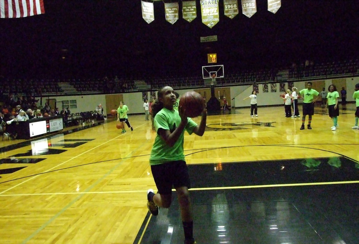 Image: Lady Gladiators next — Emmy Cunningham represents the Italy Youth Athletic Association (IYAA) during a halftime shootaround during the varsity girls game.