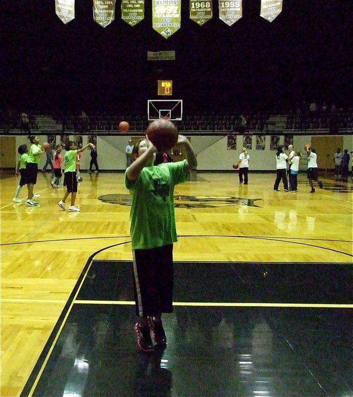 Image: Just like big girls — Carlee Wafer represents the IYAA during a halftime as a member of the 5th &amp; 6th grade Lime Green team head coached by Jimmy Henry.