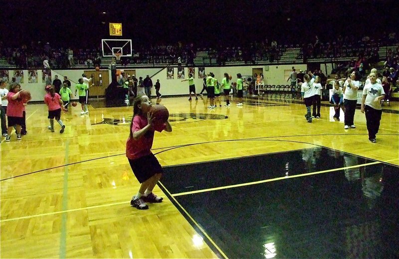 Image: Hannah takes aim — Hannah Haight prepares to shoot as part of the IYAA halftime shootaround.