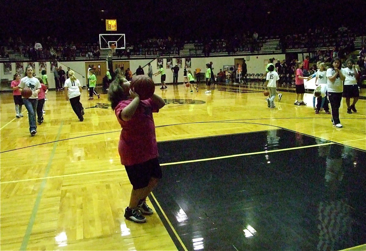 Image: Going for it — Virginia Stephens shoots a layup as part of the IYAA halftime festivities.