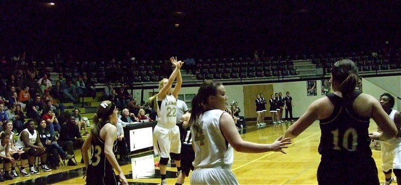 Image: Megan launches — Lady Gladiator Megan Richards(22) releases a three-point shot attempt against Grandview.