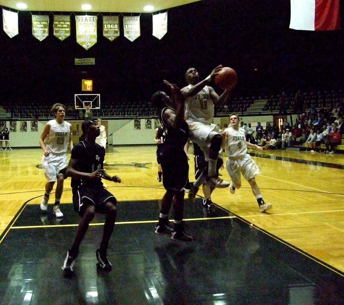 Image: Jasenio gets to the goal — Italy’s Jasenio Anderson(11) forces the issue against Grandview’s defense.