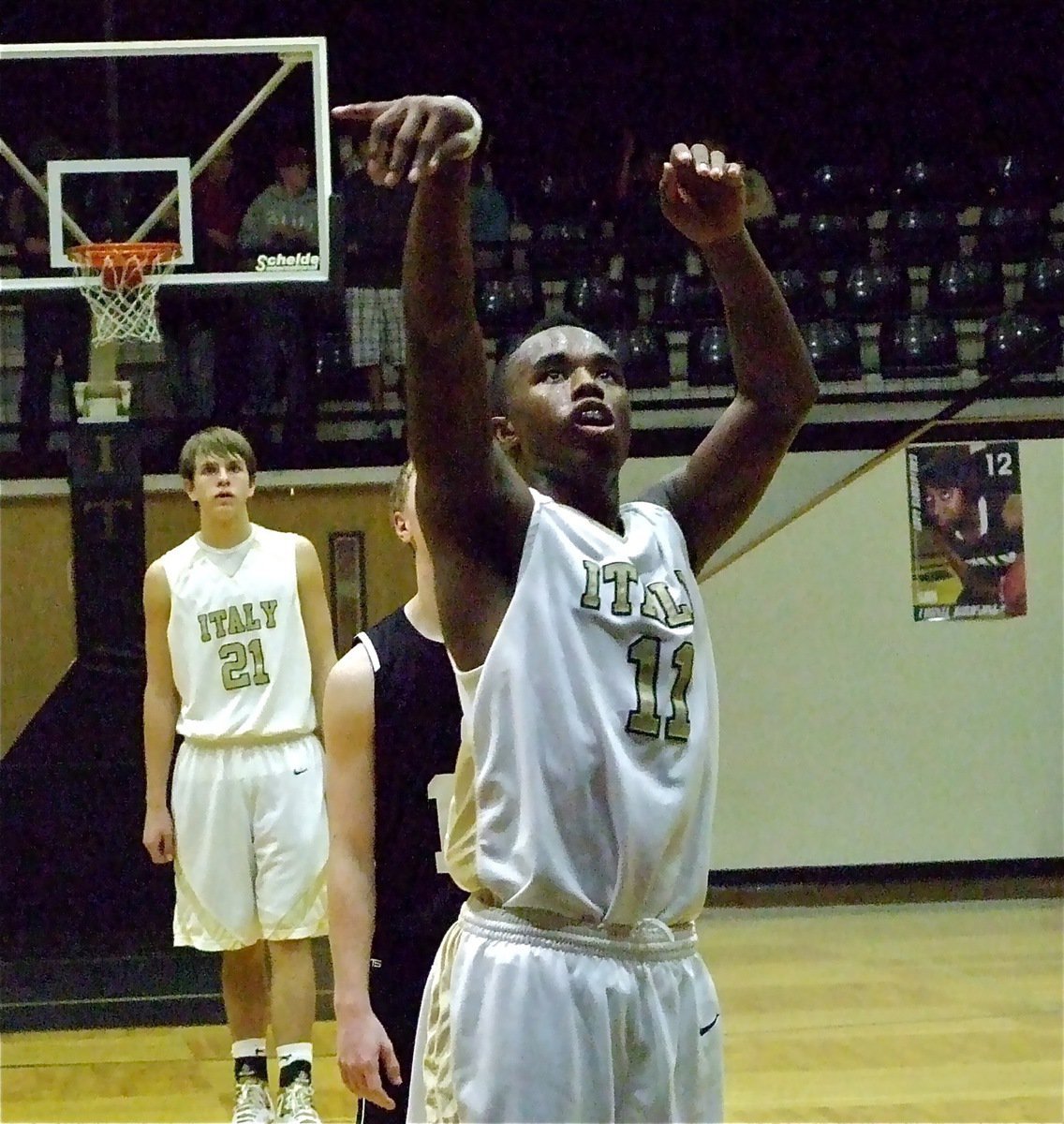 Image: One-point at a time — Cole Hopkins(21) looks on as teammate Jasenio Anderson(11) puts in a free-throw.