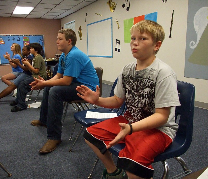 Image: Tristan’s ready to play — Tristan Upton joins his fellow 6th grade band members and claps with the beat.