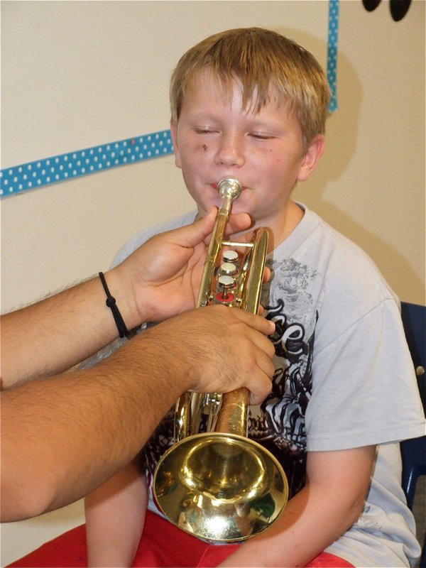 Image: Trumpet test — Tristan tries to imagine having his own instrument to play.