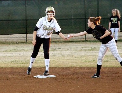Image: Nice hit — Megan Richards(22) spends her time hitting when she’s not busy pitching and records a double against Palmer.