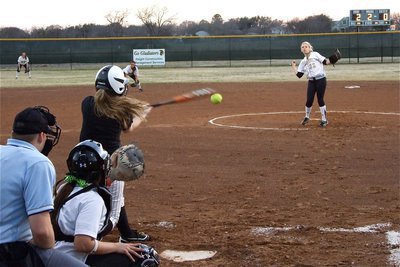 Image: Bat has a hole in it — Sisters, catcher Alyssa Richards and pitcher Megan Richards, were on their game and kept Palmer off their mark.