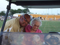 Image: Larry and Lorene — Coach Larry Mayberry helps Mrs. Bryant into her chariot.
