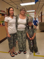 Image: It is “Camo” Day — Amy McClesky and Paula Mandrell and one of the cutest students sporting their “Camo”.