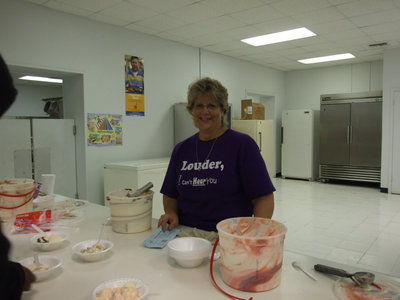 Image: Cheryl Sessums — Cheryl Sessums dishing up delicious ice cream treats.