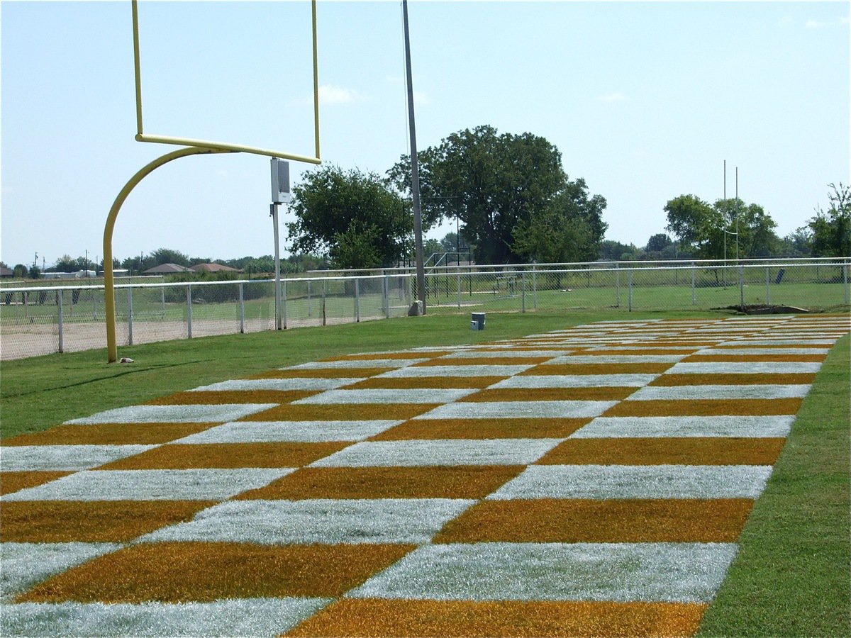 Image: Check out the endzone pattern! — On Thursday, Italy ISD School Board members Jon Mathers, Curtis Riddle, Paul Cockerham and Italy ISD maintenance crewman Michael Chambers painted both endzones at Willis Field in preparation for the Homecoming game Friday night.