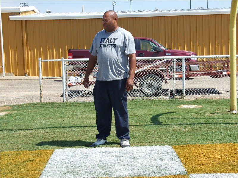 Image: Larry’s impressed! — Larry Mayberry stops by to check out the gold and white painted checkerboard pattern that now decorates both endzones at Willis Field for the Homecoming game.