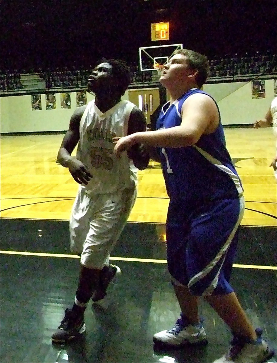 Image: Walker working — Italy’s Raheem Walker(55) battles for position under the basket.