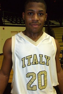 Image: Strike a pose — Jalarnce Jamal Lewis(20) is proud of his team after winning the Italy JV Basketball Tournament hosted by Italy.