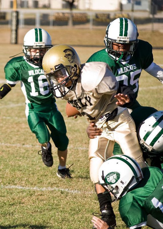 Image: Breaking Tackles — 2 – Tylan Wallace plows his way through the Scurry defense.