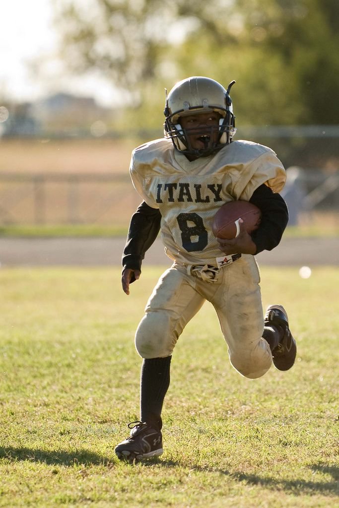 Image: Busting Out — 8 – Kendrick Norwood breaks from the pack searching for some running room in the Conference Championship game against the Wildcats from Scurry.