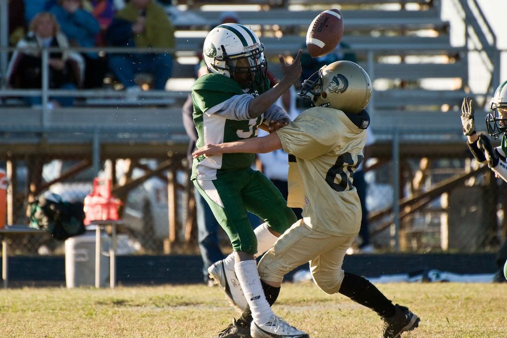 Image: Turnovers And Tears — Big Isaac Salcido collides with a Scurry player as blood, sweat and tears go flying.