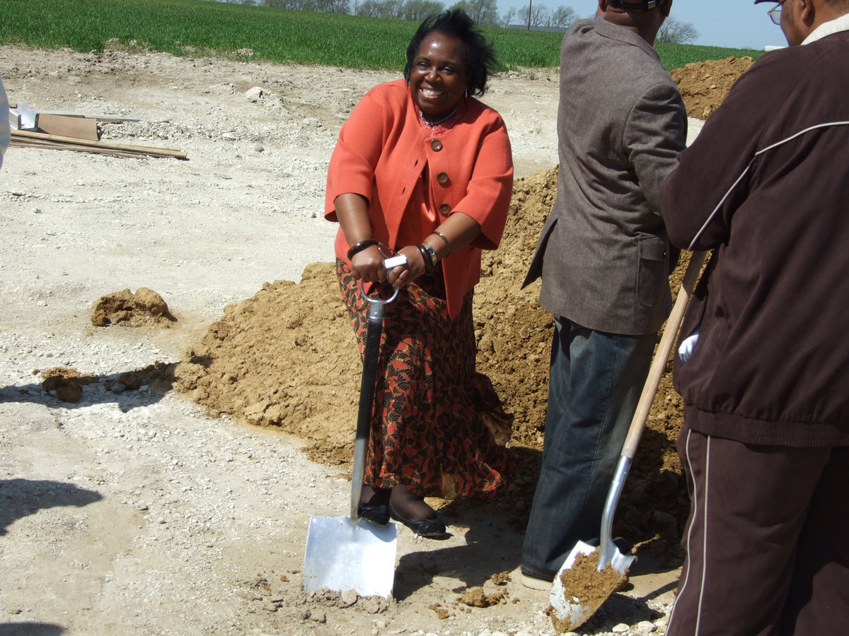 Image: First Lady has fun — First Lady Isaac turns some dirt at the ceremony as well.