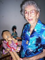 Image: Christine Holcomb — Christine poses with her vintage dolls.