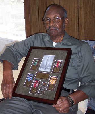 Image: Otis Wilson — Otis displays his medals of honor.