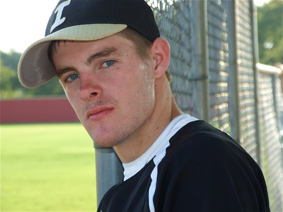 Image: Ryan’s game face — Catcher Ryan Ashcraft enjoys a cool breeze before suiting up in the catching gear.