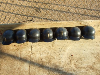 Image: “I” is represented — A row of Italy batting helmets signals it’s game time.