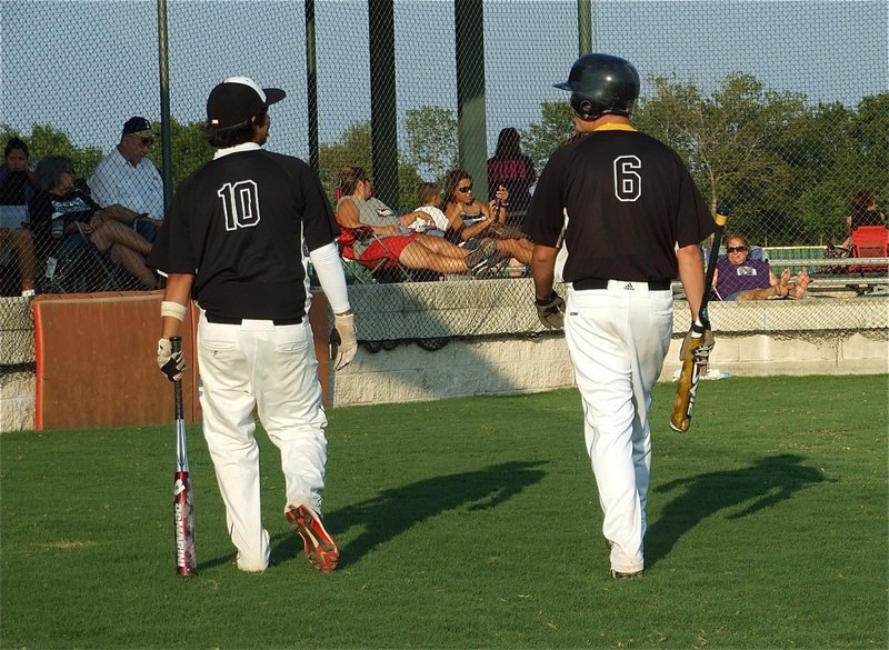 Image: Walk in the park — Michael “Taz” Martinez(10) and Casey “Queso” Williams(6) study the field before the game.