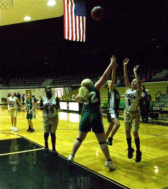 Image: Going for it — Brittany Chambers(1) puts up a shot over two Rio Vista defenders.
