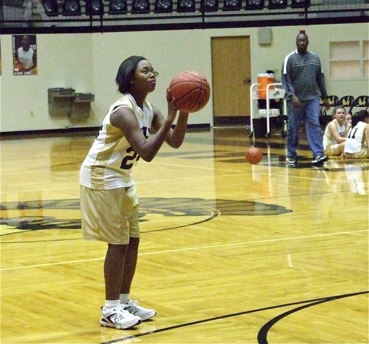 Image: Kierra practices — Kierra Wilson(24) practices a three-point shot before the 8th Grade girls game against Rio Vista.