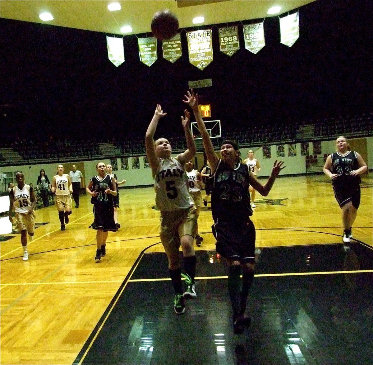 Image: Tara on the break — Tara Wallis(5) sprints to the basket for a score.