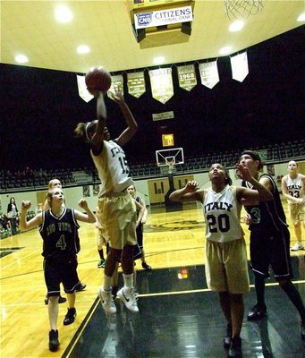 Image: Johnson jumps — Kortnei Johnson(15) rises for two-points with teammate Tylar Wilson(20) ready to rebound.