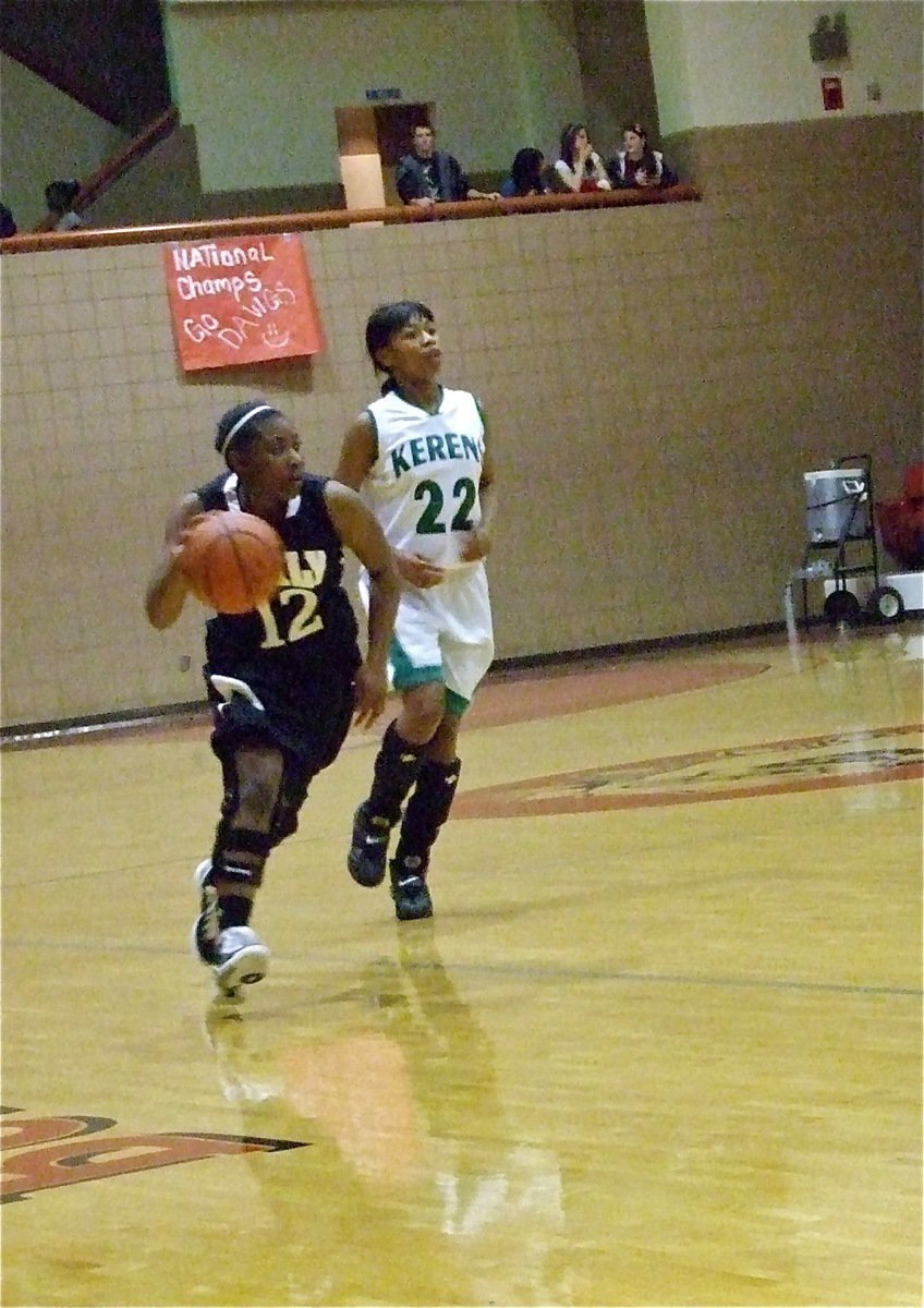 Image: Up the court — Italy’s Chante Birdsong(12) pushes the ball past Kerens.