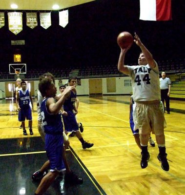 Image: Jump shot — John Byers(44) shoots from the baseline.