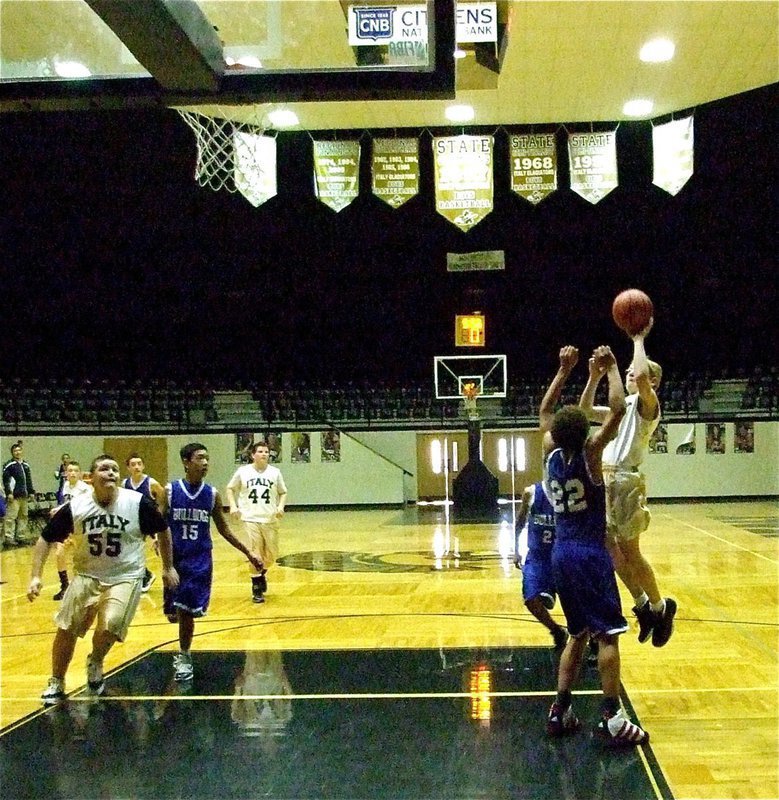 Image: Fast breaking — Cody Boyd(10) pulls up for a jumper as teammate Kelton Bales(55) heads for the rebound.