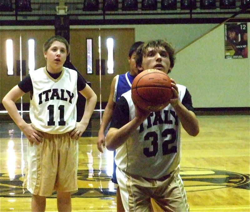 Image: Chace from the stripe — Chace McGinnis(32) knocks down a free-throw in the fourth-quarter against Venus as teammate John Escamilla(11) looks on.