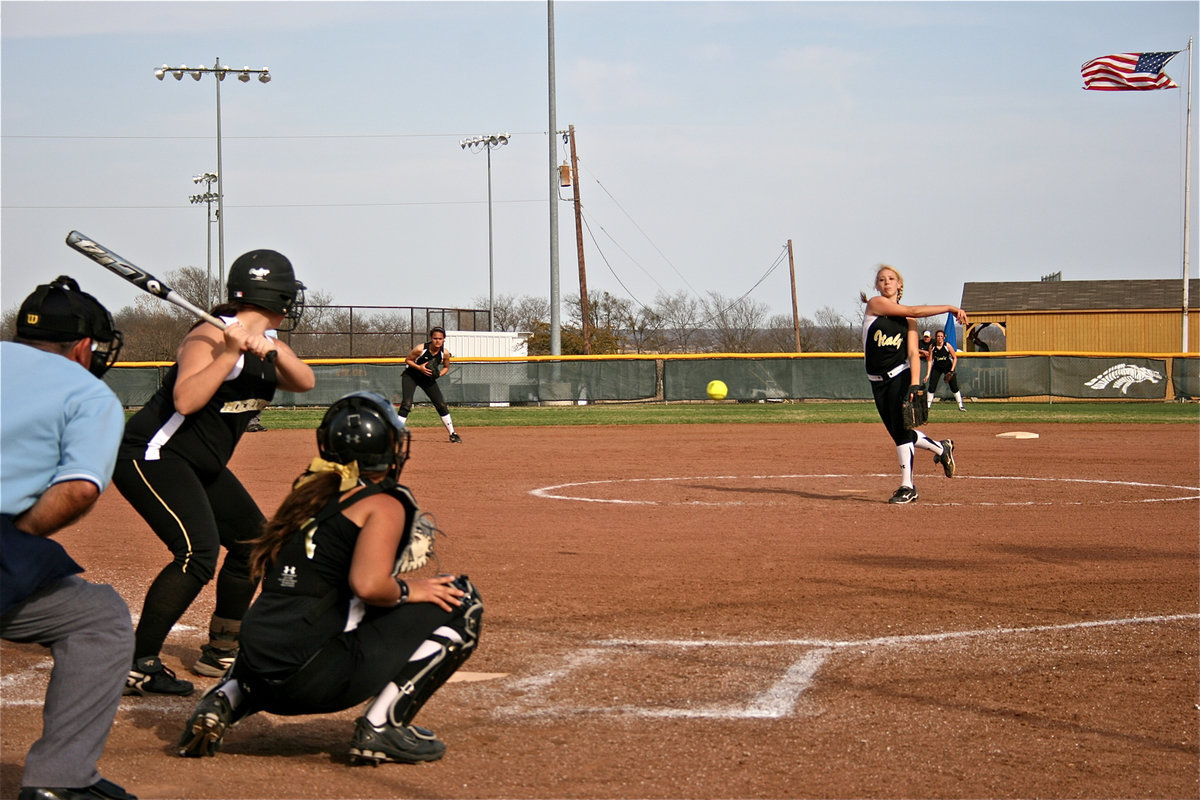 Image: A young Lady Gladiator team is learning fast, one pitch at a time. — Pitcher Megan Richards(17) leads the Lady Gladiators by throwing one strike after another while little sister Alyssa Richards(4) controls the game from behind the plate.