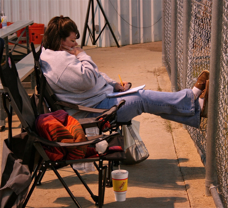 Image: Kicked back — Nancy Byers kept the books during the Grandview Tournament as she did here during the Italy vs. Mart matchup.