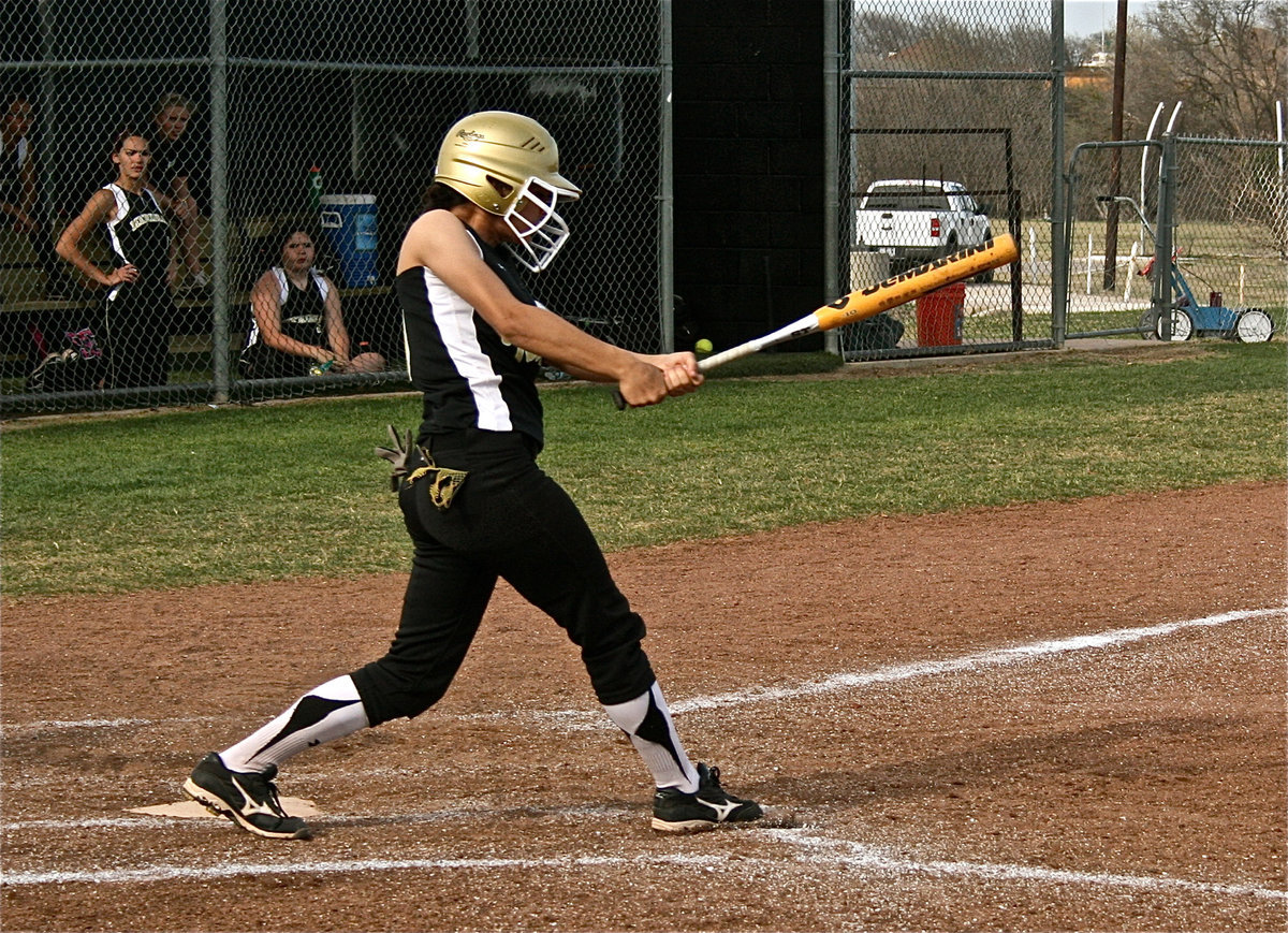 Image: How it’s done! — Anna Viers powers a shot over Meridians infield.