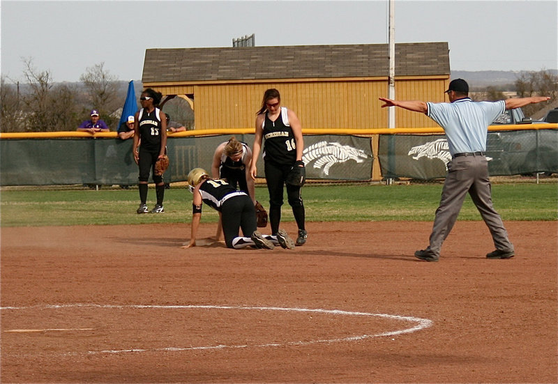 Image: Be safe out there — Italy’s Megan Richards(17) slides head first into second base to beat the throw by Meridian.