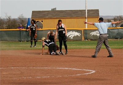 Image: Be safe out there — Italy’s Megan Richards(17) slides head first into second base to beat the throw by Meridian.