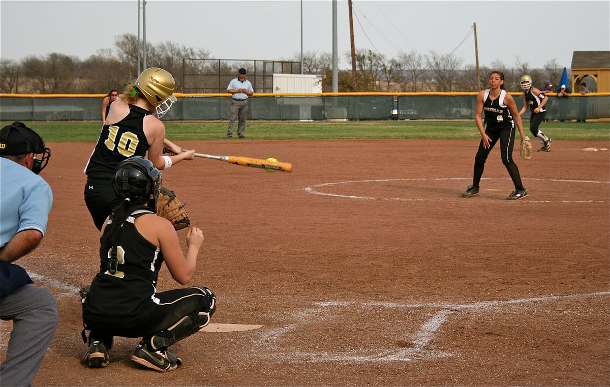 Image: On the mark — Italy’s Paige Westbrook(10) connects with the ball for a base hit.