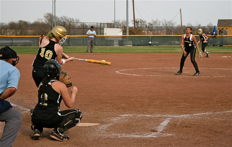 Image: On the mark — Italy’s Paige Westbrook(10) connects with the ball for a base hit.