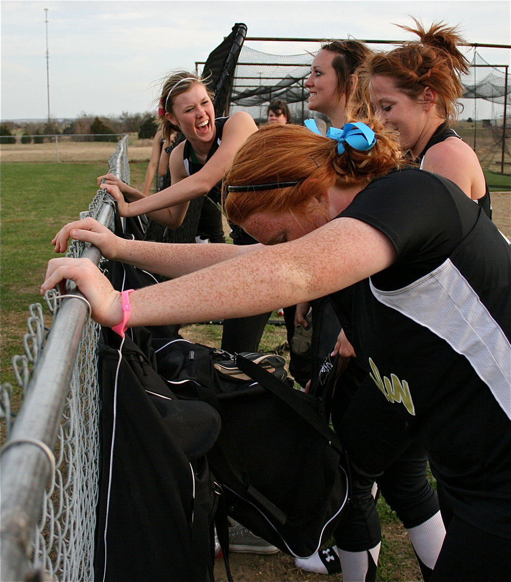 Image: Happy ladies — Kaitlyn Rossa, Breyanna Beets, Bailey Bumpus and Katie Byers are unable to contain their winning smiles after beating Meridian.